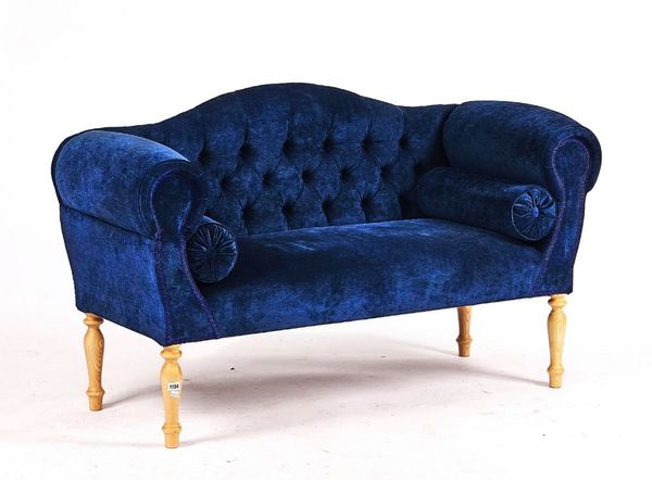 A REGENCY STYLE BLUE UPHOLSTERED SMALL HUMP BACK SOFA