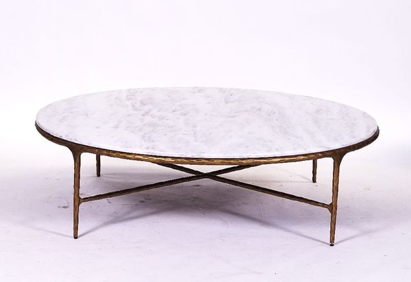 AFTER GIACOMETTI; A LARGE CIRCULAR MARBLE TOPPED COFFEE TABLE