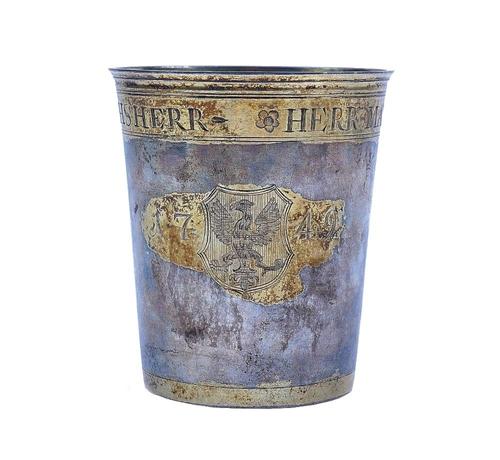 A PARCEL GILT BEAKER