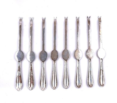 SEVEN SILVER LOBSTER PICKS AND ONE FURTHER LOBSTER PICK (8)