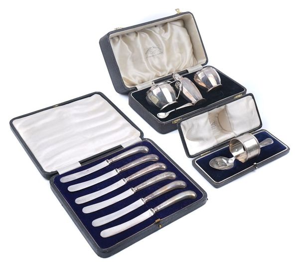 A SILVER CONDIMENT SET AND TWO FURTHER CASED ITEMS (3)