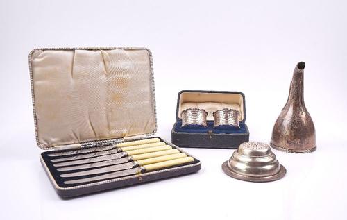 A SILVER WINE FUNNEL WITH A PLATED STRAINER AND TWO FURTHER ITEMS