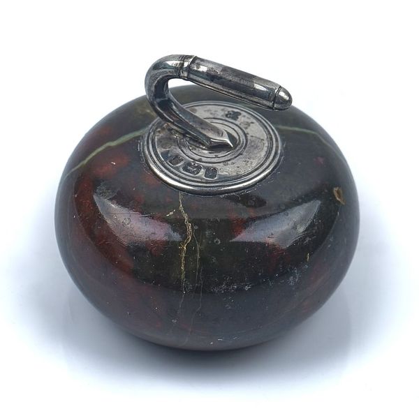 A SILVER MOUNTED SERPENTINE CURLING STONE PAPERWEIGHT
