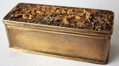 A GEORGE IV SILVER GILT RECTANGULAR HINGE LIDDED SNUFF BOX