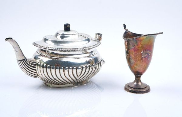 A SILVER TEAPOT AND A SILVER CREAM JUG (2)