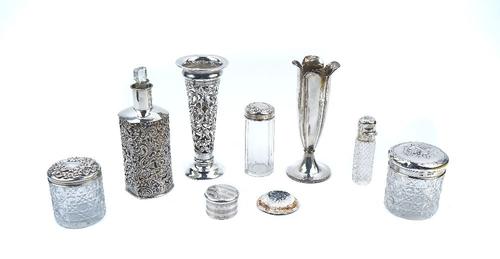 A GROUP OF SILVER AND ALSO SILVER MOUNTED GLASS BOTTLES AND JARS (8)