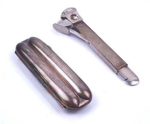 A SILVER CIGAR CASE AND A SILVER MOUNTED CIGAR CUTTER (2)