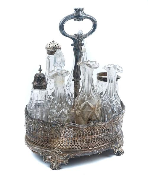 A SILVER SEVEN BOTTLE CRUET STAND