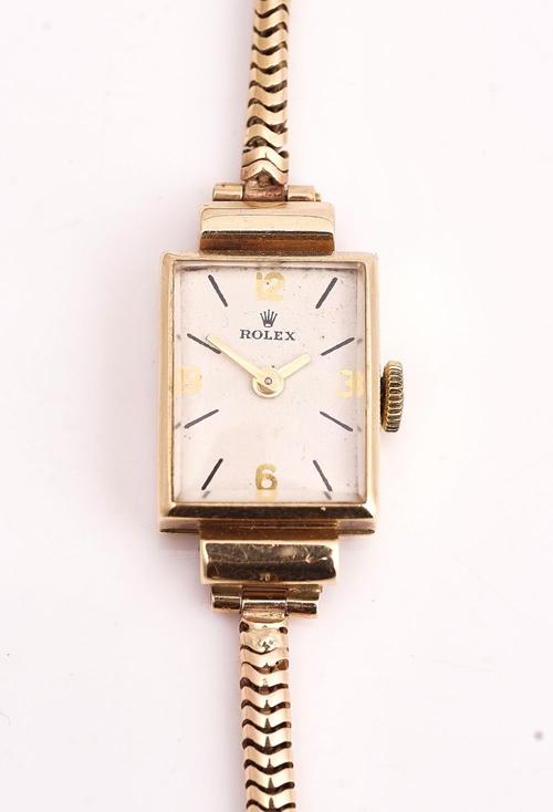 A ROLEX 9CT GOLD RECTANGULAR CASED LADIES WRIST WATCH