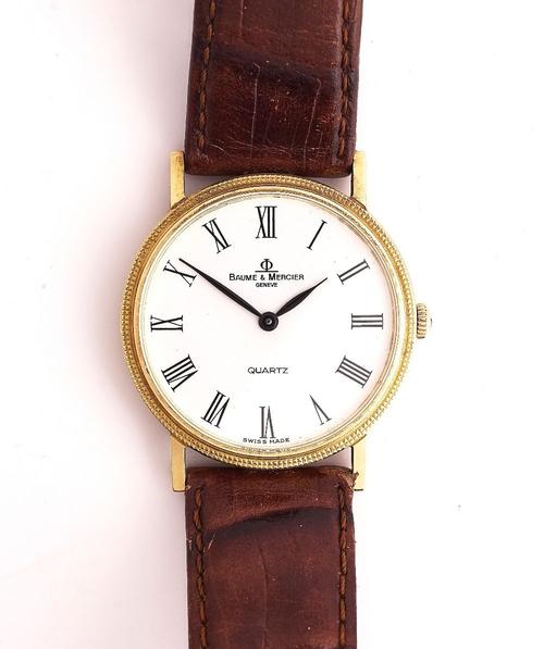 A BAUME & MERCIER QUARTZ GOLD CIRCULAR CASED GENTLEMAN'S WRISTWATCH