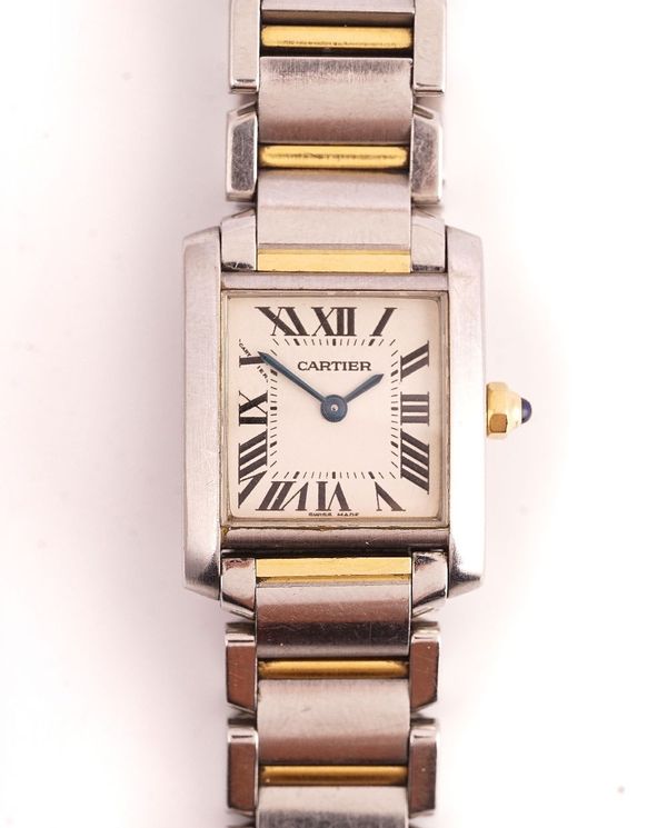 A CARTIER TWO COLOUR STEEL AND GOLD LADY'S TANK BRACELET WRISTWATCH