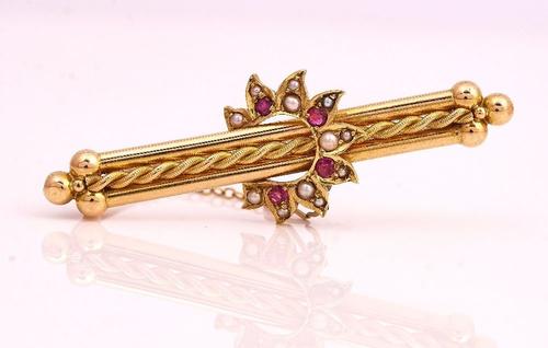 A GOLD SEED PEARL AND RUBY BAR BROOCH
