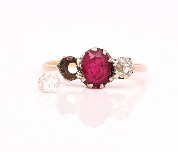 A GOLD, RUBY AND DIAMOND THREE STONE RING