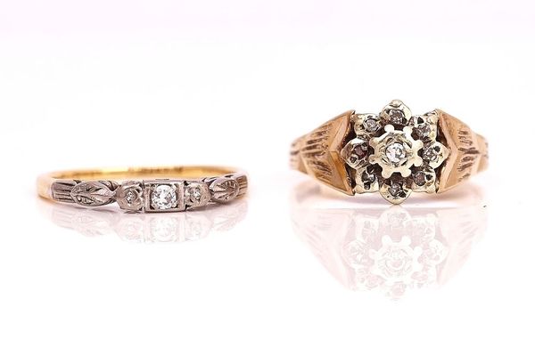 A GOLD AND DIAMOND THREE STONE RING AND A 9CT GOLD AND DIAMOND CLUSTER RING (2)