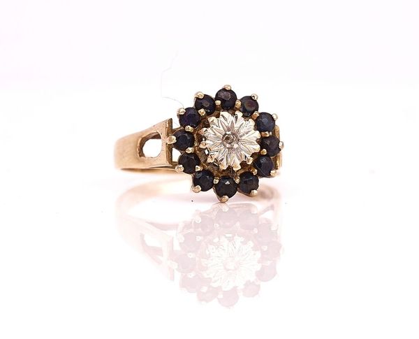 A 9CT GOLD, SAPPHIRE AND DIAMOND CLUSTER RING