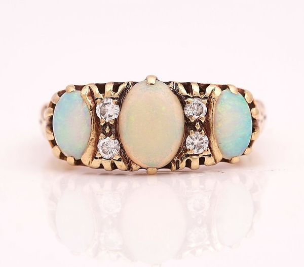 A 9CT GOLD, OPAL AND DIAMOND RING