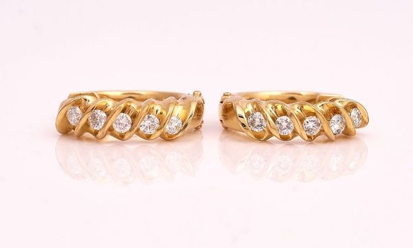 A PAIR OF GOLD AND DIAMOND FIVE STONE EARRINGS
