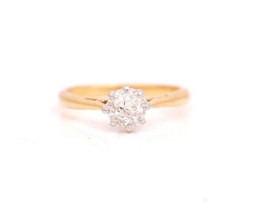 A GOLD AND PLATINUM DIAMOND SINGLE STONE RING