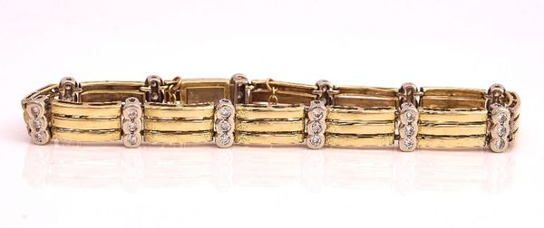 A TWO COLOUR GOLD AND DIAMOND BRACELET