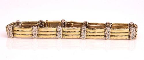 A TWO COLOUR GOLD AND DIAMOND BRACELET