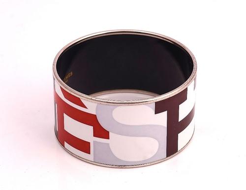 A HERMES PARIS ENAMELED BANGLE