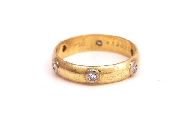 A CARTIER GOLD AND DIAMOND SET BAND RING