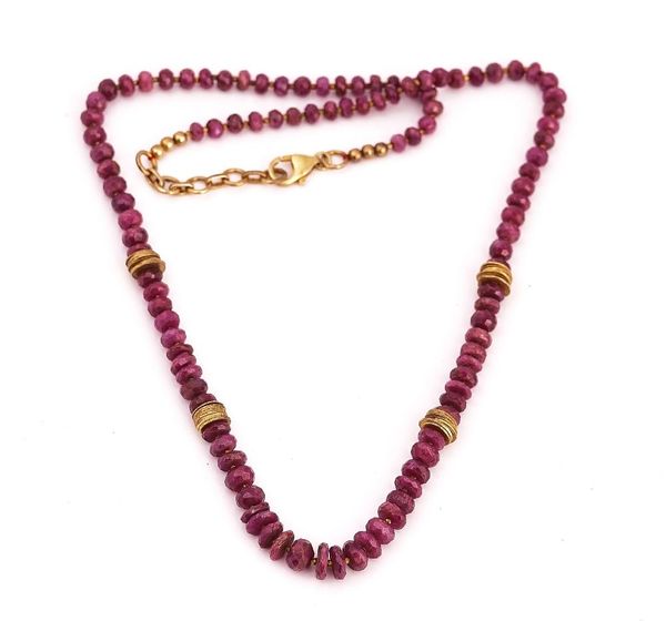 A SINGLE ROW NECKLACE OF FACETED RUBY BEADS