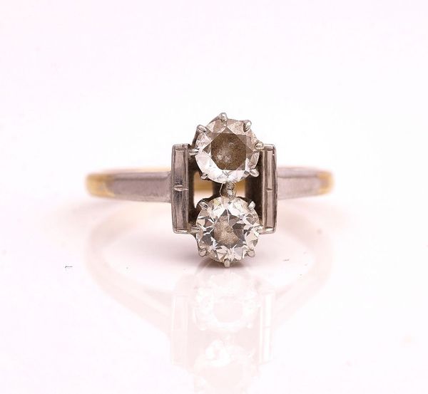 A GOLD AND PLATINUM DIAMOND TWO STONE RING