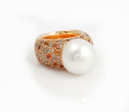 A GOLD, SOUTH SEA CULTURED PEARL, DIAMOND AND ORANGE SAPPHIRE RING
