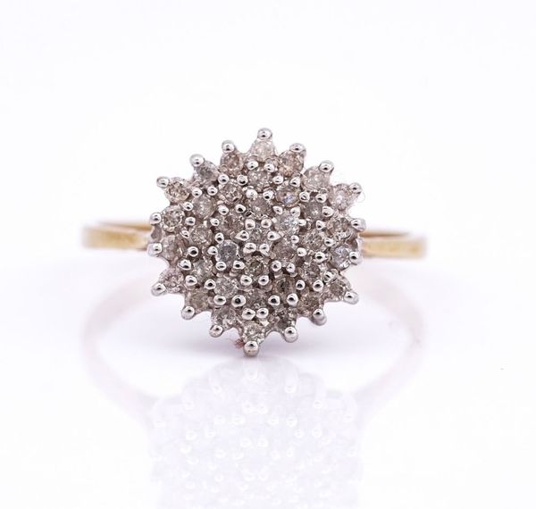 A 9CT GOLD AND DIAMOND HEXAGONAL CLUSTER RING