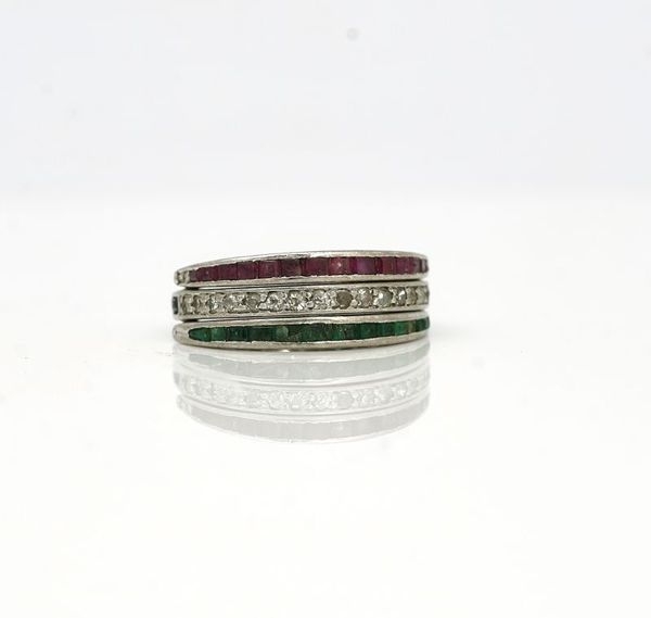 WITHDRAWN - A diamond, emerald, ruby and sapphire swing-over and under eternity ring