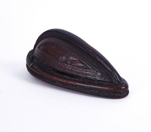 FOLK ART: A CARVED AND STAINED DOMED WOOD FLASK