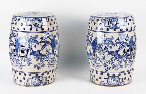 A PAIR OF CHINESE STYLE BLUE AND WHITE GLAZED CERAMIC BARREL SHAPED GARDEN SEATS (2)