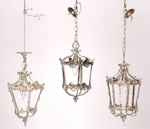 THREE SILVERED-METAL AND GLASS TAPERING HALL LANTERNS (3)