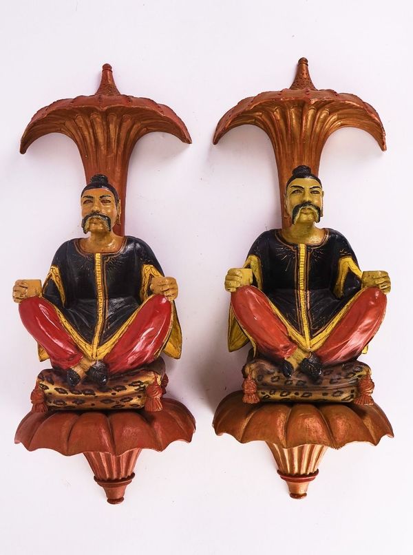 A PAIR OF CHINESE POLYCHROME DECORATED FIGURATIVE WALL MOUNTS (2)