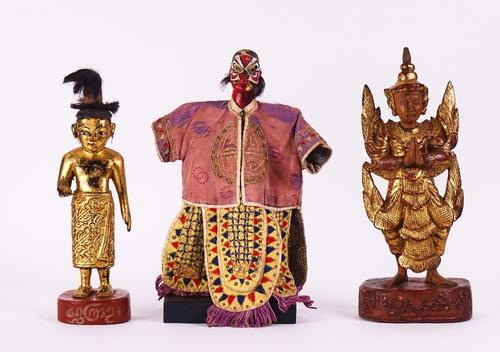 A GROUP OF FOUR SOUTH-EAST ASIAN FIGURES AND A PAIR OF GILT LACQUER SCROLL HOLDERS (6)