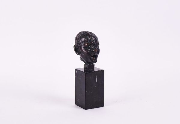 A BRONZE HEAD CAST FROM THE MODEL AFTER AUGUSTE RODIN (1840-1917)