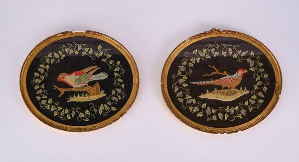 A PAIR OF OVAL SILK WORK PICTURES OF PARROTS  (2)