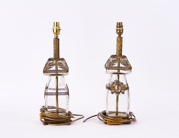 A PAIR OF FRENCH GILT-METAL MOUNTED GLASS LAMPS