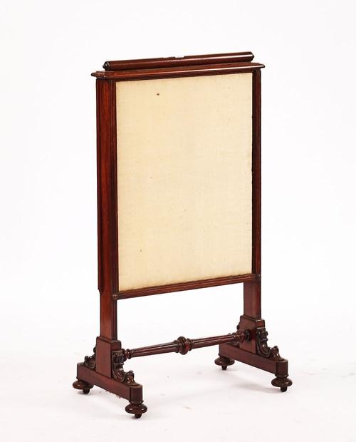A REGENCY MAHOGANY TRIPLE-WAY EXTENDING FIRESCREEN