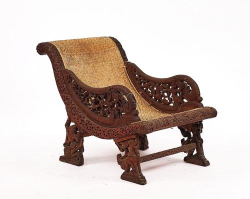 A 19TH CENTURY BURMESE CARVED HARDWOOD PLANTATION STYLE CHAIR