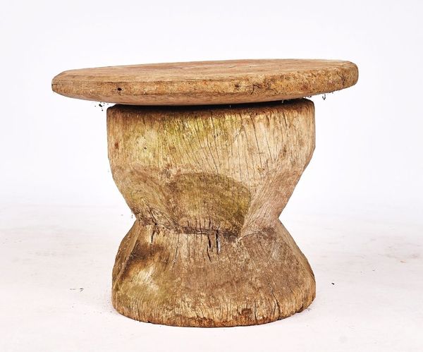 A LARGE DUG-OUT WOODEN PESTLE