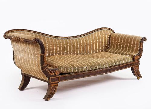 A REGENCY PARCEL-GILT EBONISED CHAISE LONGUE