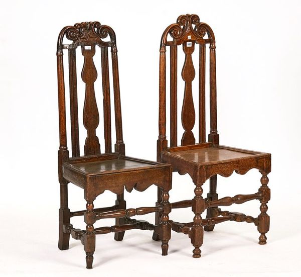 TWO SIMILAR EARLY 18TH CENTURY OAK HIGH-BACK DINING CHAIRS (2)