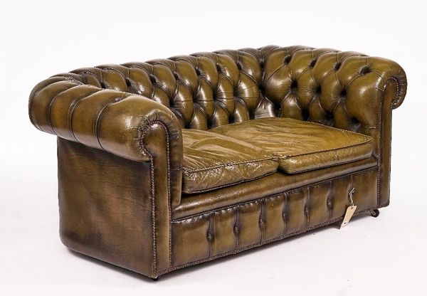 A GREEN LEATHER UPHOLSTERED BUTTON-BACK CHESTERFIELD