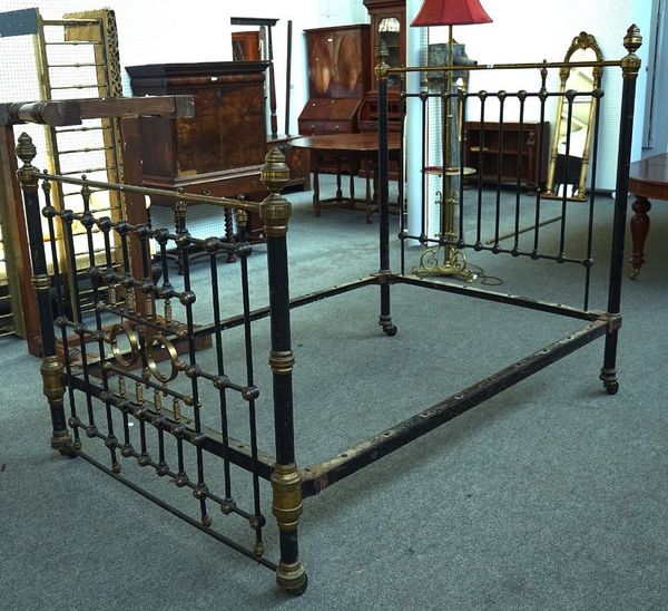 A LATE VICTORIAN LACQUERED BRASS AND BLACK PAINTED IRON DOUBLE BED