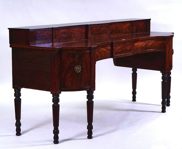 AN EARLY 19TH CENTURY SCOTTISH INLAID MAHOGANY CONCAVE FRONTED SIDE BOARD