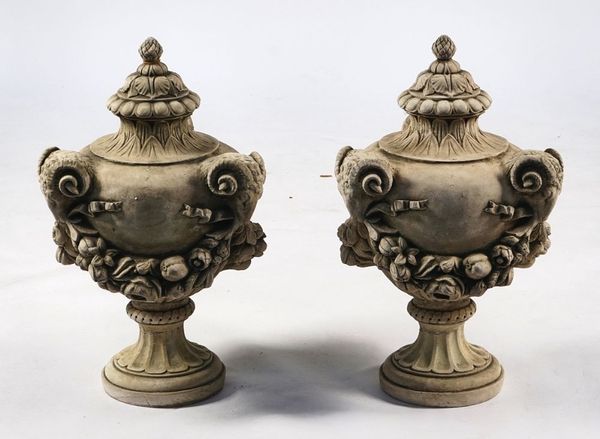 A PAIR OF RECONSTITUTED STONE URN FINIALS (2)