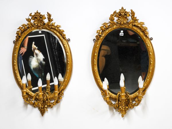 A PAIR OF LATE 19TH CENTURY GILT FRAMED OVAL GIRANDOLE WALL MIRRORS (2)