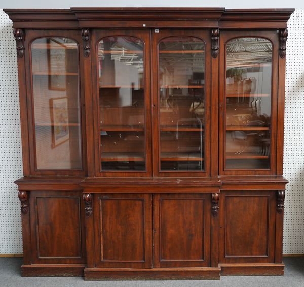 JAMES WINER AND SONS, 101 WARDOUR STREET, SOHO, LONDON; A 19TH CENTURY MAHOGANY BREAKFRONT BOOKCASE CABINET